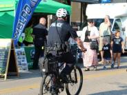 Image of policeman riding a bike