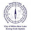 zoning code update logo shape of a compass with a bear in the middle